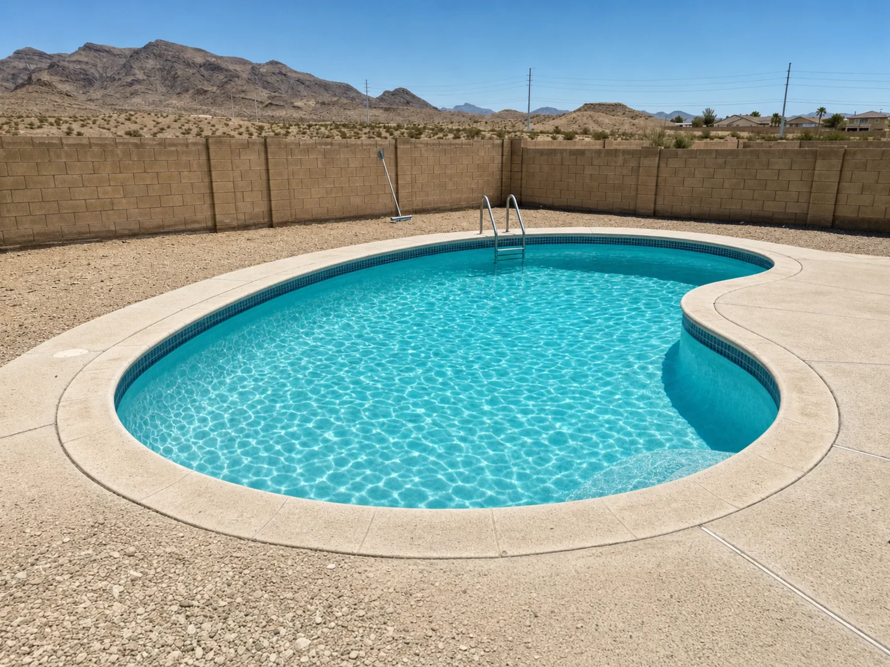 Restored kidney-shaped pool with clean tile and clear water